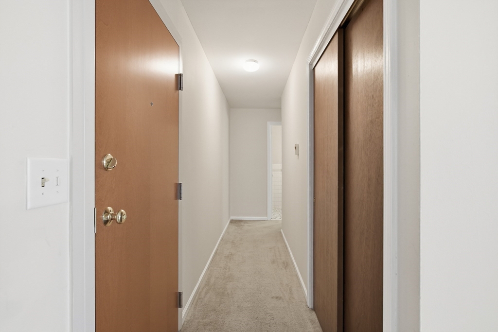 74 Barrett Street, Unit 308 Northampton, MA 01060 - Photo 11 of 22 a view of a hallway with wooden floor