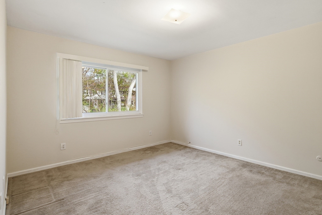 74 Barrett Street, Unit 308 Northampton, MA 01060 - Photo 14 of 22 an empty room with windows