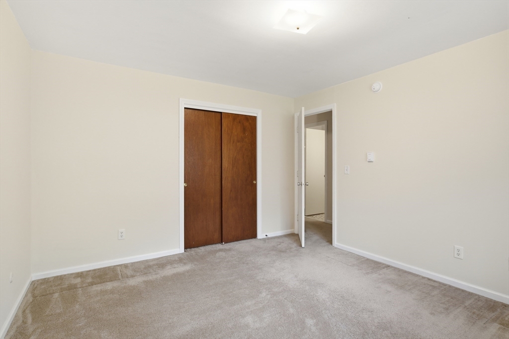 74 Barrett Street, Unit 308 Northampton, MA 01060 - Photo 15 of 22 a view of an empty room and closet area