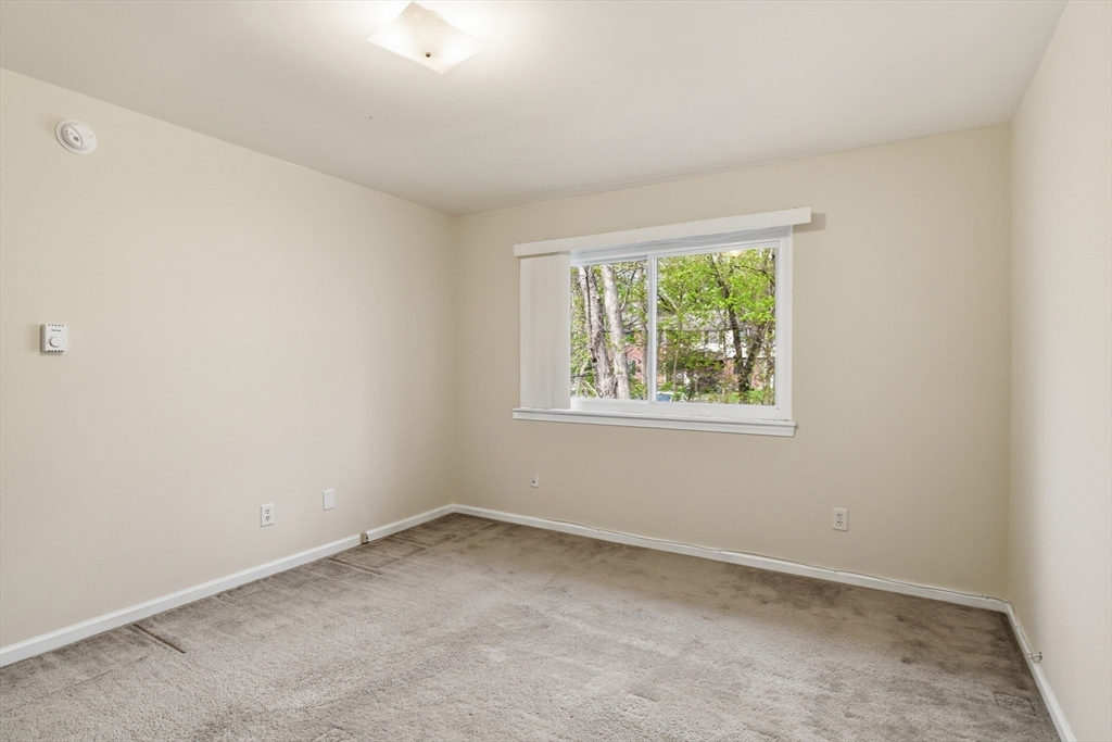 74 Barrett Street, Unit 308 Northampton, MA 01060 - Photo 16 of 22 an empty room with a window