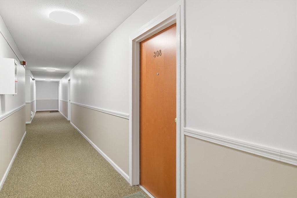 74 Barrett Street, Unit 308 Northampton, MA 01060 - Photo 20 of 22 a view of hallway with stairs