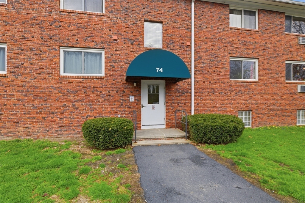 74 Barrett Street, Unit 308 Northampton, MA 01060 - Photo 21 of 22 a front view of a house with garden