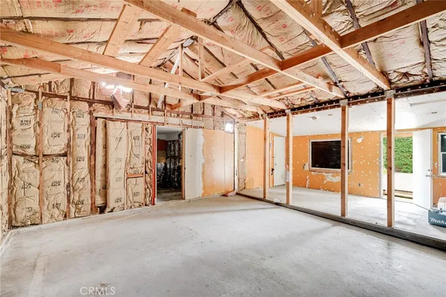 a swimming pool with outdoor seating and plants