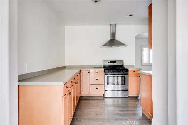 a kitchen with a stove and a microwave