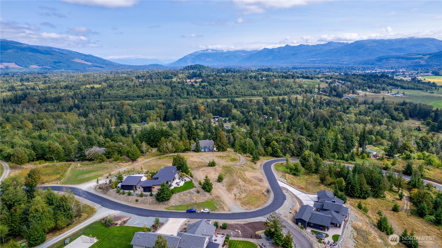 7583 Avalon Heights Way Sedro-Woolley, WA 98284 - Photo 17 of 28 an aerial view of a house with garden space and mountains