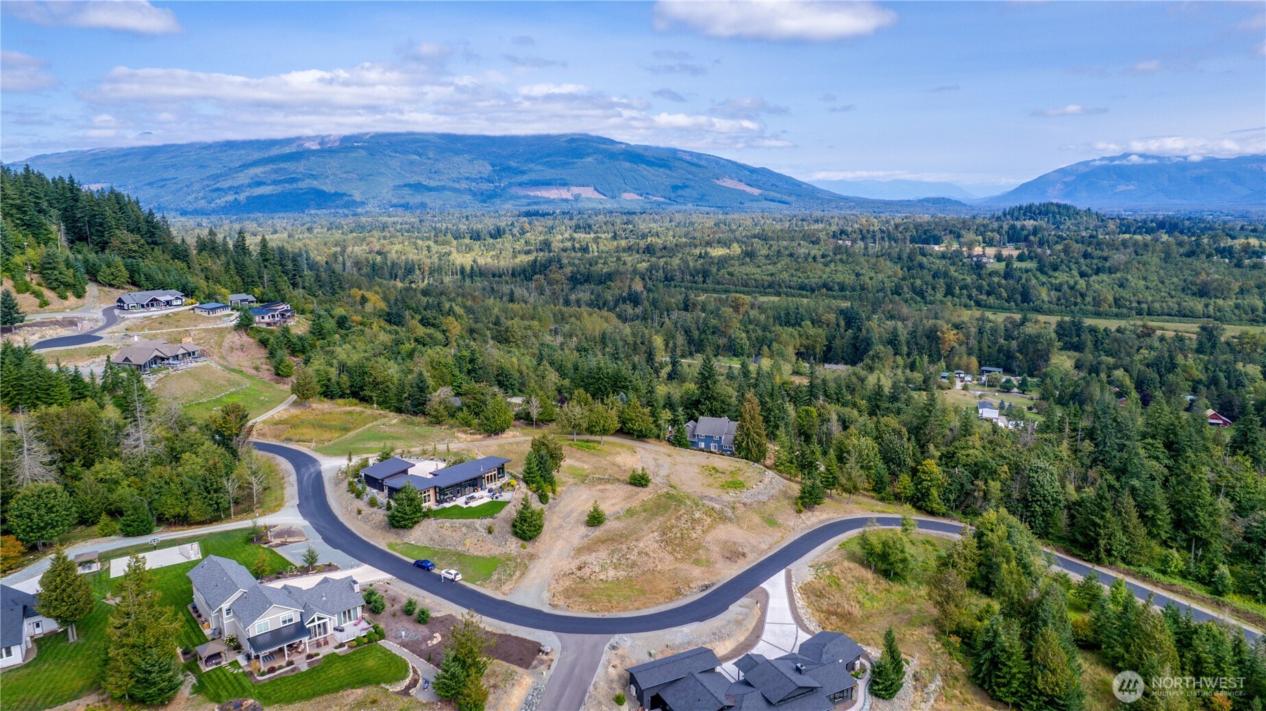 7583 Avalon Heights Way Sedro-Woolley, WA 98284 - Photo 18 of 28 a view of a swimming pool with a yard and mountain view