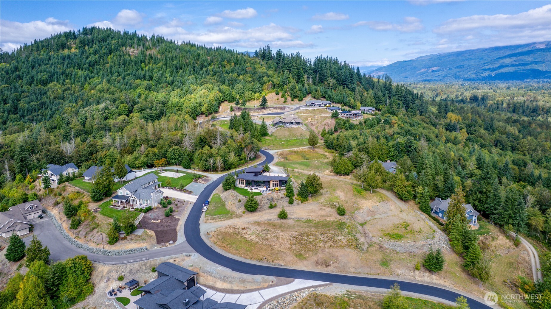 7583 Avalon Heights Way Sedro-Woolley, WA 98284 - Photo 20 of 28 a view of a swimming pool with a yard and mountain view