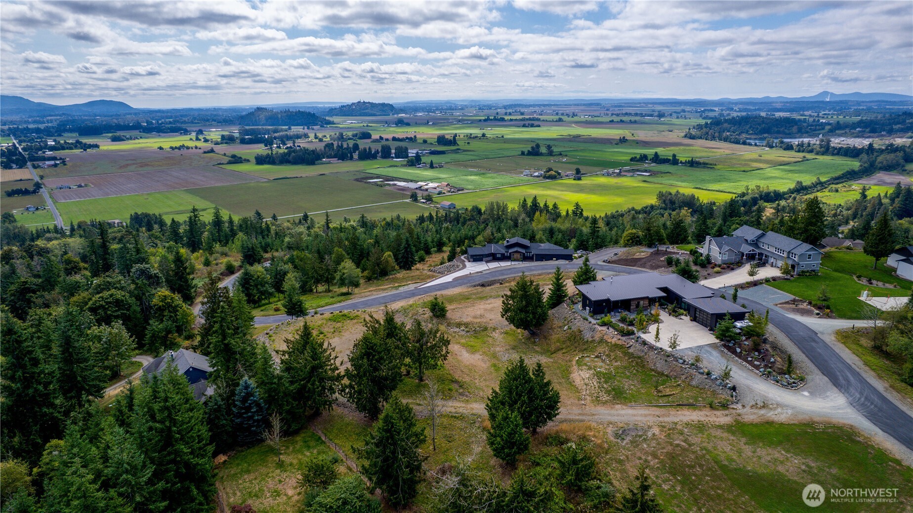 7583 Avalon Heights Way Sedro-Woolley, WA 98284 - Photo 25 of 28 a view of a lake with a city