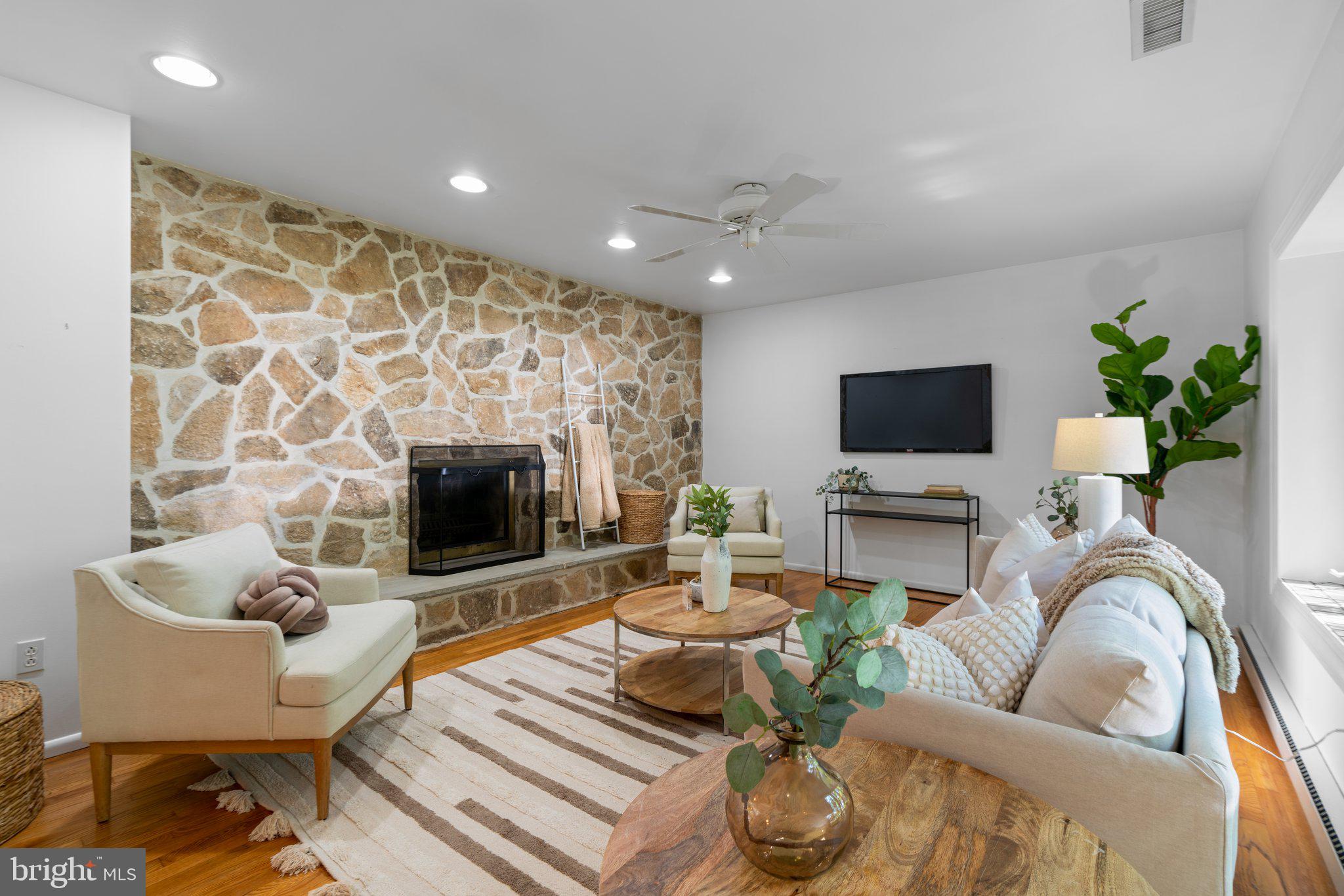 12412 Hall Shop Road Fulton, MD 20759 - Photo 12 of 97 Main level; living room w/ stone accent wall.