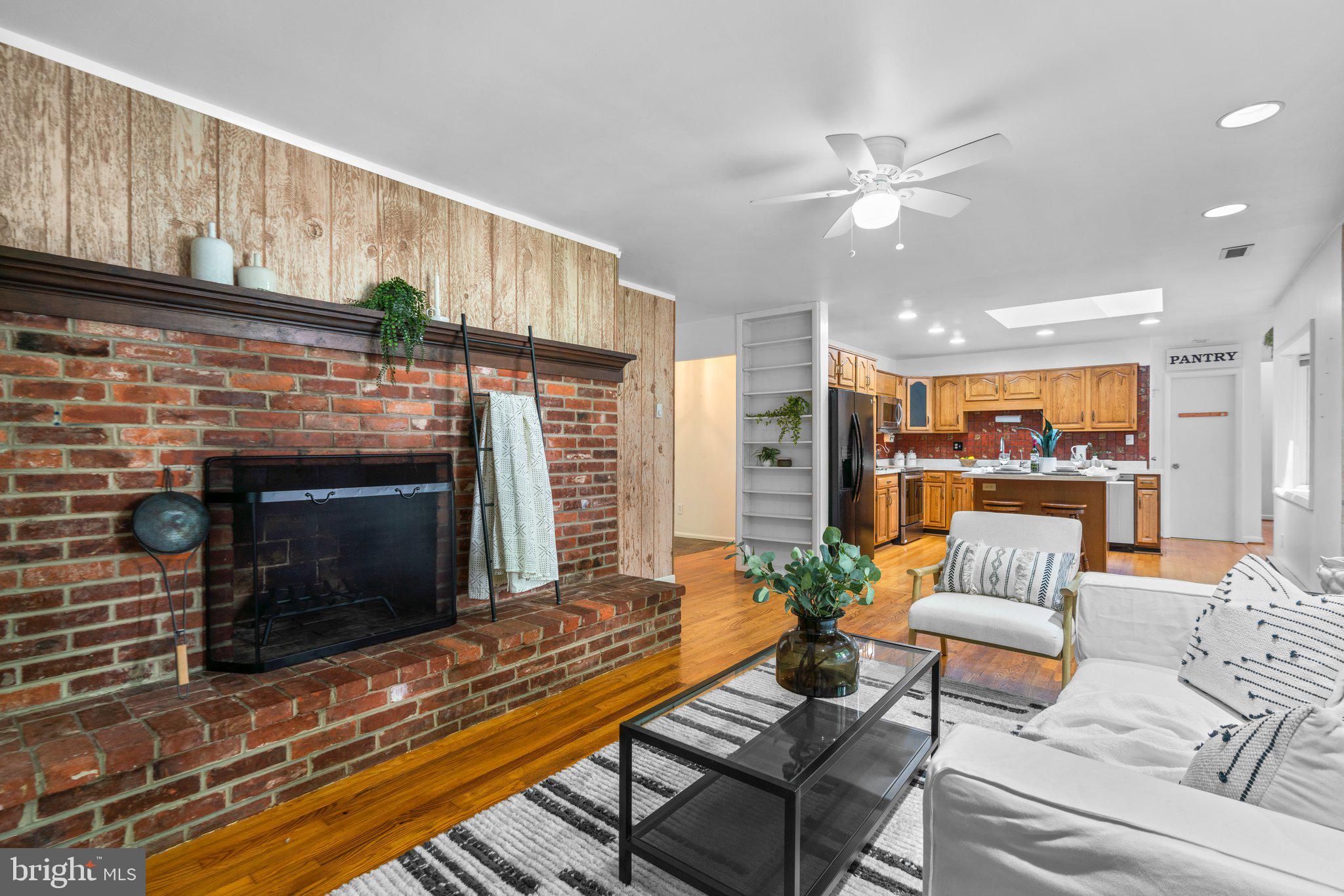 12412 Hall Shop Road Fulton, MD 20759 - Photo 18 of 97 Main level; 2 of 3 fireplaces, opens off kitchen.