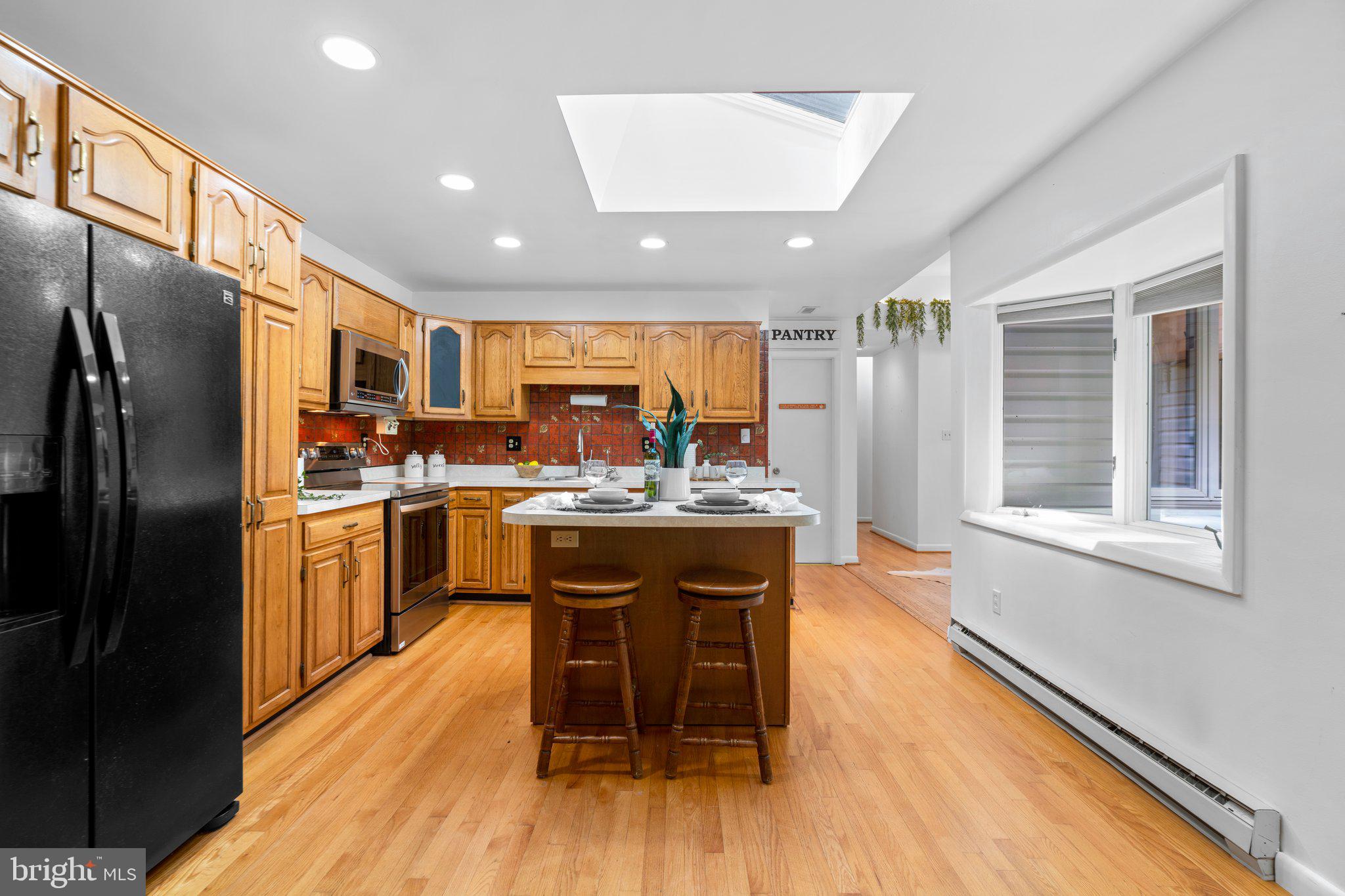 12412 Hall Shop Road Fulton, MD 20759 - Photo 20 of 97 Main level; kitchen w/ updated appliances, island.