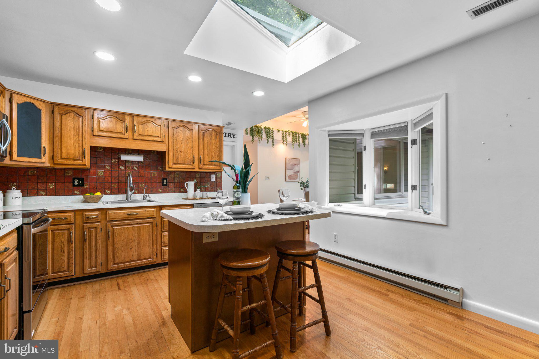 12412 Hall Shop Road Fulton, MD 20759 - Photo 21 of 97 Main level; kitchen w/ updated appliances, island.
