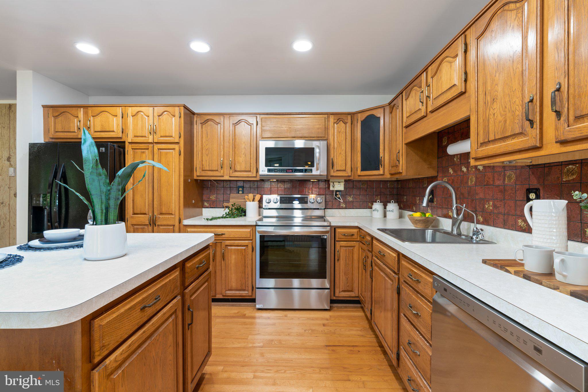 12412 Hall Shop Road Fulton, MD 20759 - Photo 23 of 97 Main level; kitchen w/ updated appliances, island.