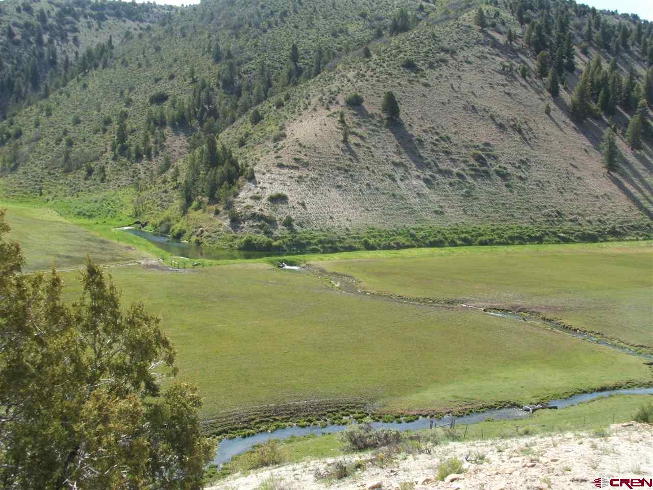 11539 Rbc 5 Road Rifle, CO 81650 - Photo 5 of 34 a view of a lake with a mountain