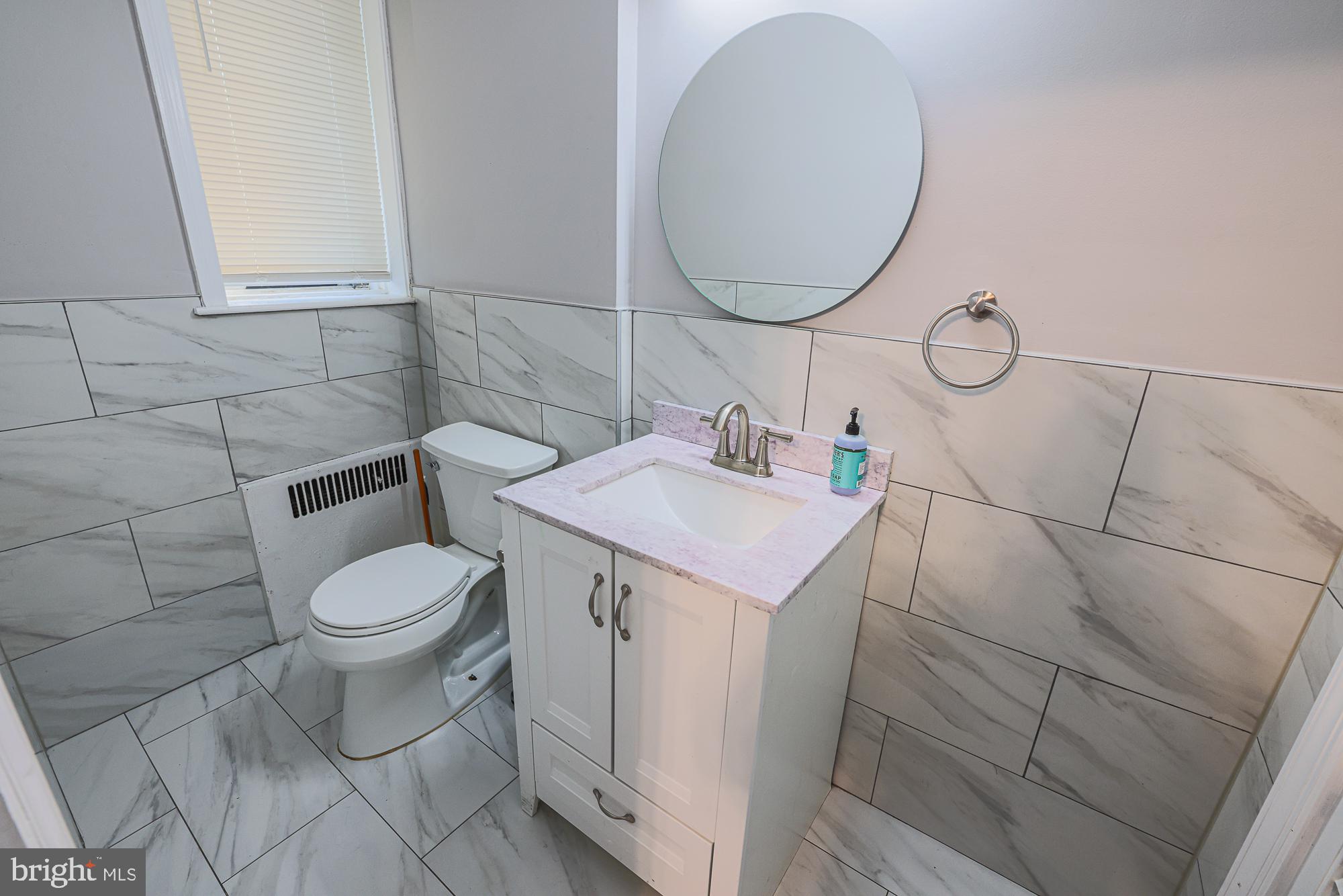 3305 Bancroft Road Baltimore, MD 21215 - Photo 36 of 61 Modern bathroom with elegant tiles.