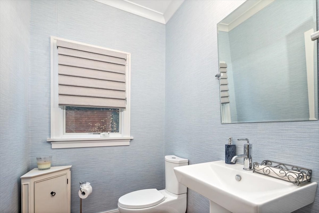 22 Raynor Drive, Unit 22 Hingham, MA 02043 - Photo 13 of 41 a bathroom with a sink a toilet and mirror