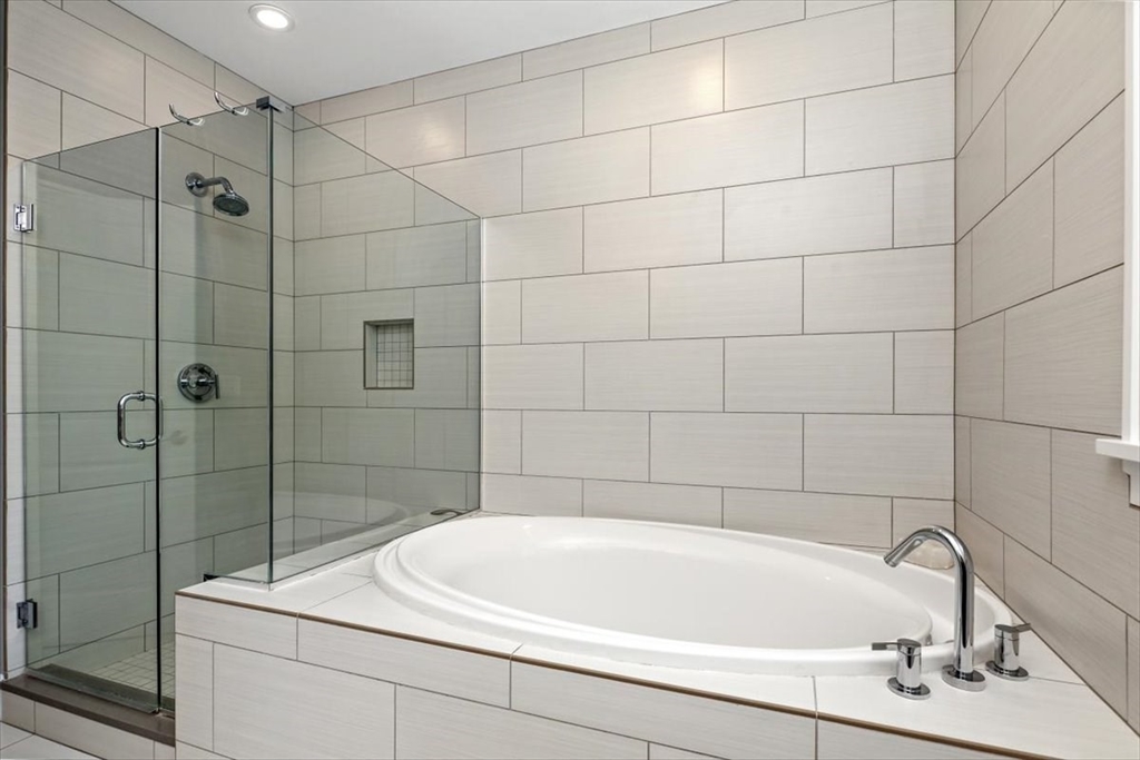 22 Raynor Drive, Unit 22 Hingham, MA 02043 - Photo 20 of 41 a bathroom with a sink and shower