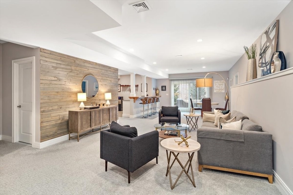22 Raynor Drive, Unit 22 Hingham, MA 02043 - Photo 31 of 41 a living room with furniture and kitchen view
