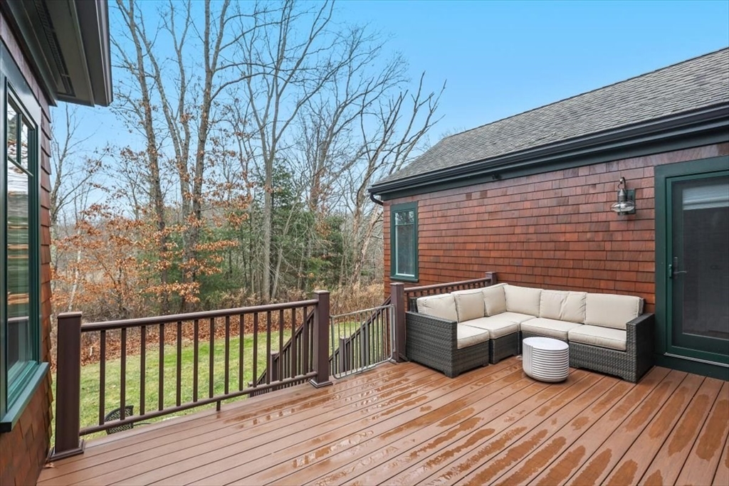 22 Raynor Drive, Unit 22 Hingham, MA 02043 - Photo 34 of 41 a view of a deck with couches and wooden floor