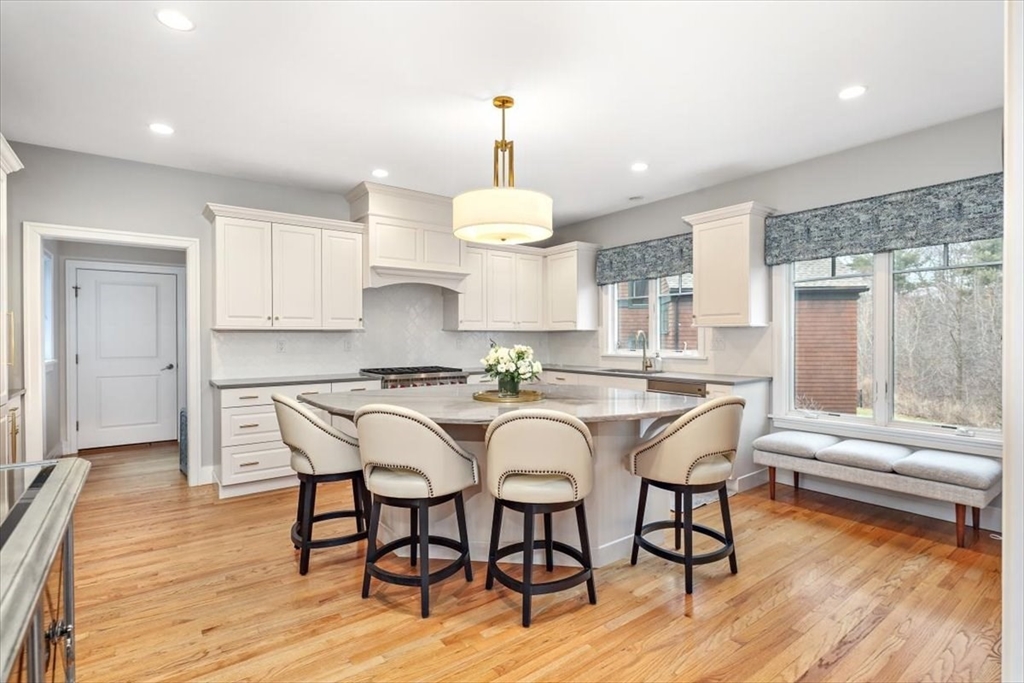 22 Raynor Drive, Unit 22 Hingham, MA 02043 - Photo 4 of 41 a view of a dining room with furniture window and wooden floor