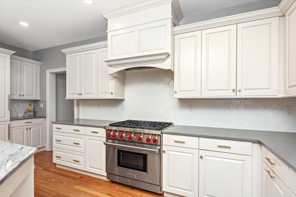 22 Raynor Drive, Unit 22 Hingham, MA 02043 - Photo 6 of 41 a kitchen with white cabinets and white appliances