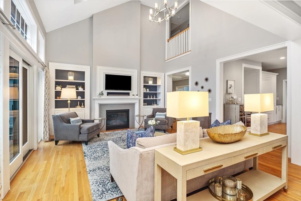 22 Raynor Drive, Unit 22 Hingham, MA 02043 - Photo 8 of 41 a living room with fireplace furniture and a flat screen tv