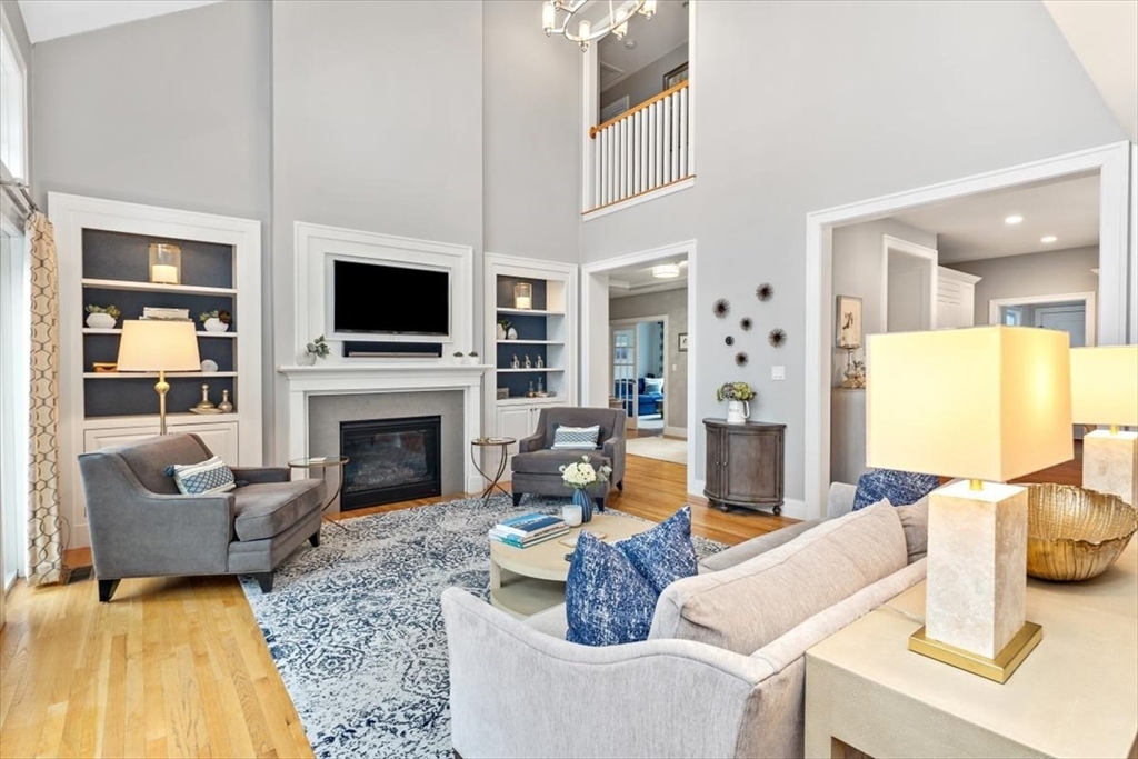 22 Raynor Drive, Unit 22 Hingham, MA 02043 - Photo 10 of 41 a living room with furniture a fireplace and a flat screen tv