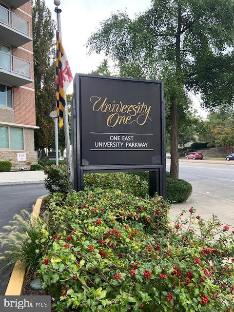 1 East University Parkway, Unit 304 Baltimore, MD 21218 - Photo 1 of 18 a sign on the side of a street