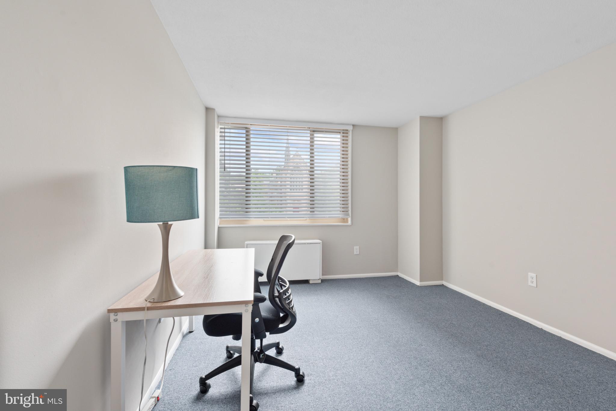 1 East University Parkway, Unit 304 Baltimore, MD 21218 - Photo 12 of 18 a workspace with furniture and a window