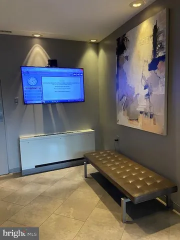 a room with furniture and wall paintings