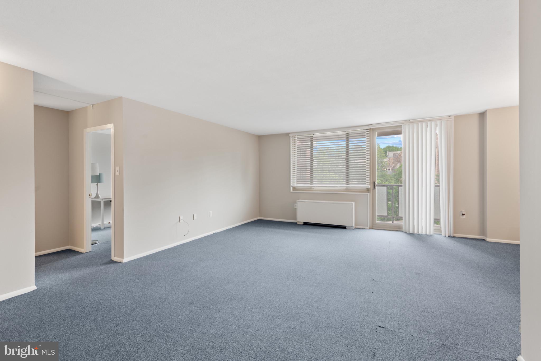 1 East University Parkway, Unit 304 Baltimore, MD 21218 - Photo 6 of 18 a view of empty room with a fireplace