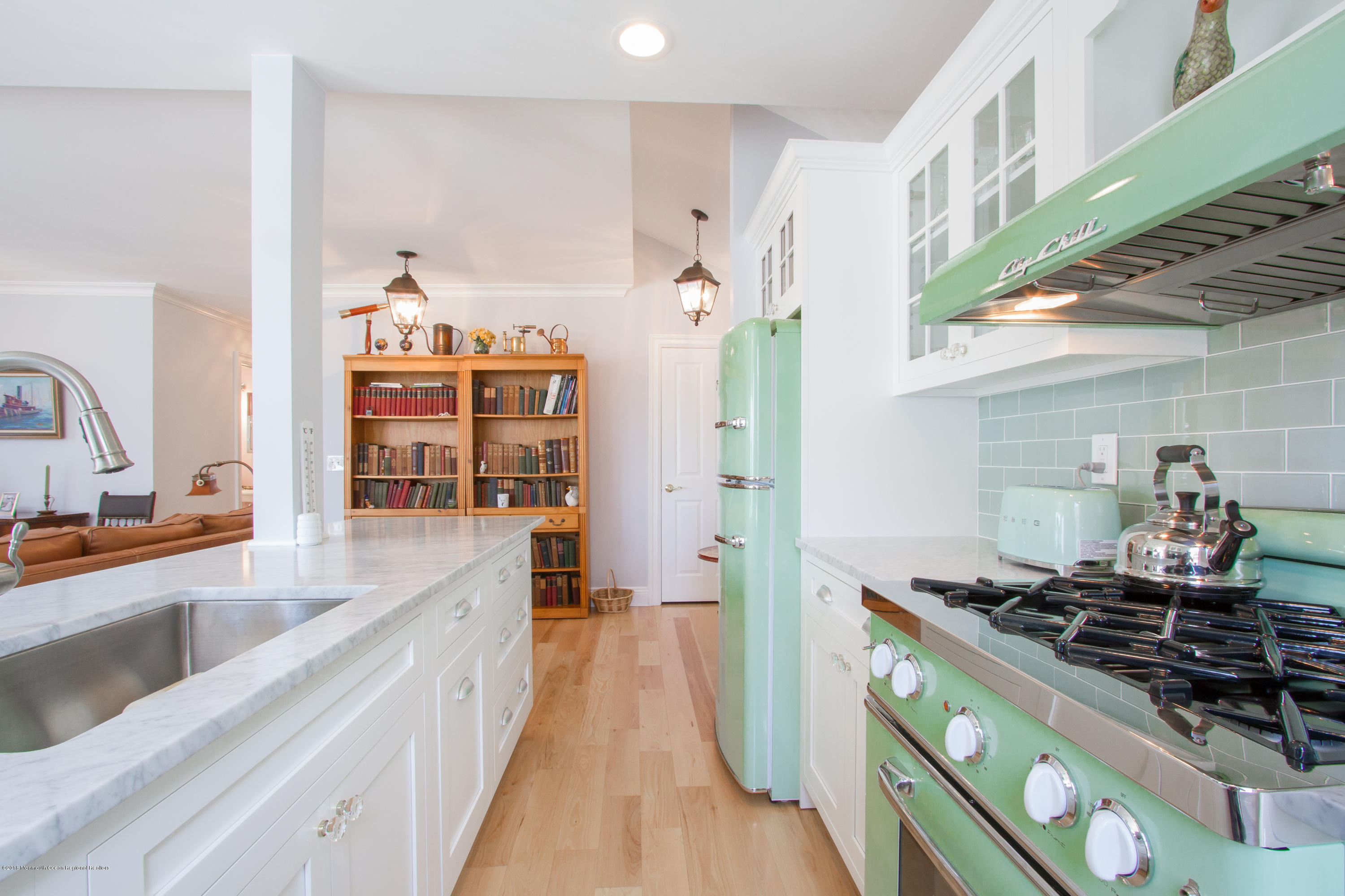 27 Center Street Sea Bright, NJ 07760 - Photo 11 of 51 a kitchen with stainless steel appliances a stove and a sink