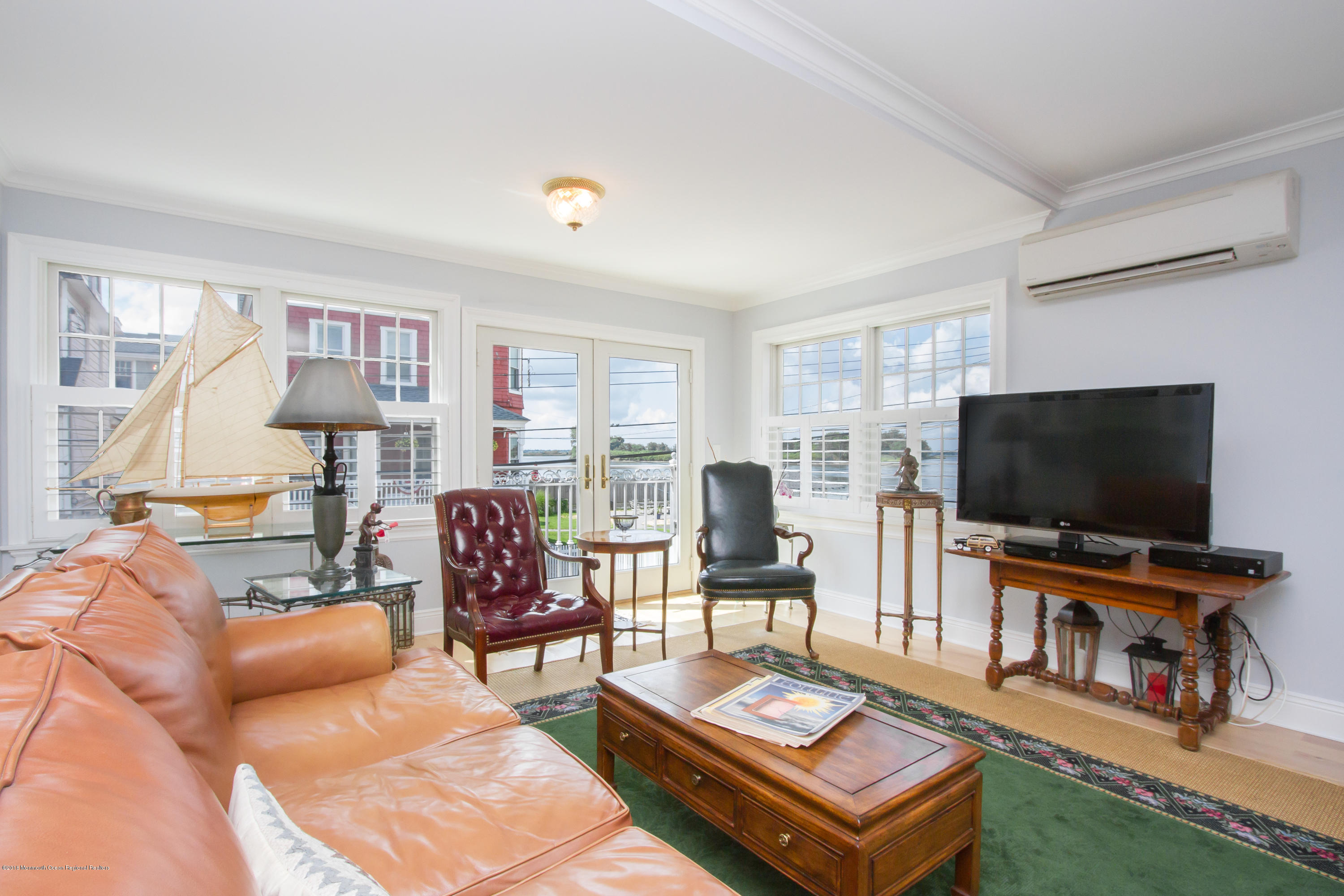 27 Center Street Sea Bright, NJ 07760 - Photo 13 of 51 a living room with furniture and a flat screen tv