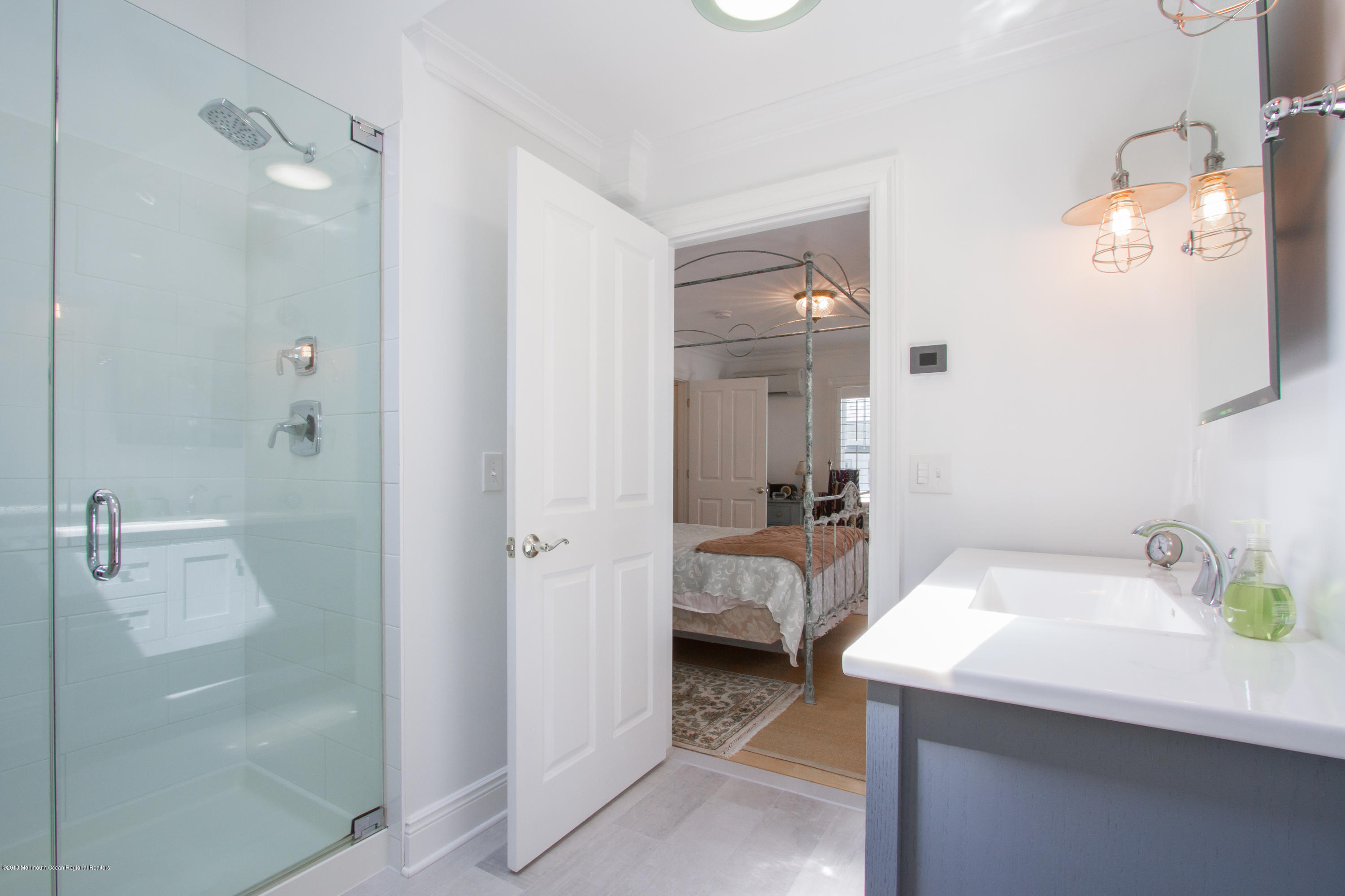 27 Center Street Sea Bright, NJ 07760 - Photo 20 of 51 a bathroom with a sink and mirror