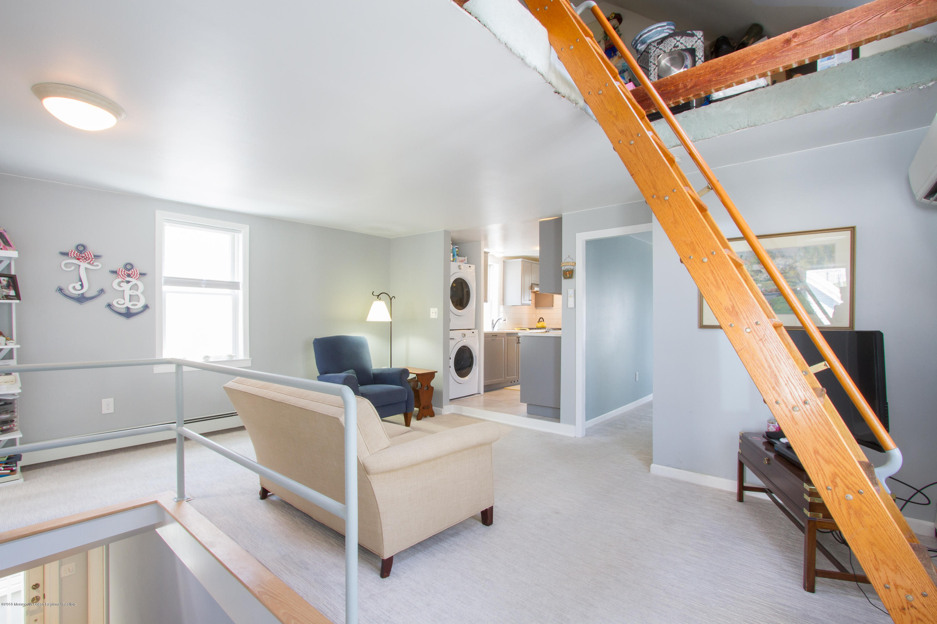 27 Center Street Sea Bright, NJ 07760 - Photo 26 of 51 a view of a livingroom with furniture and stairs