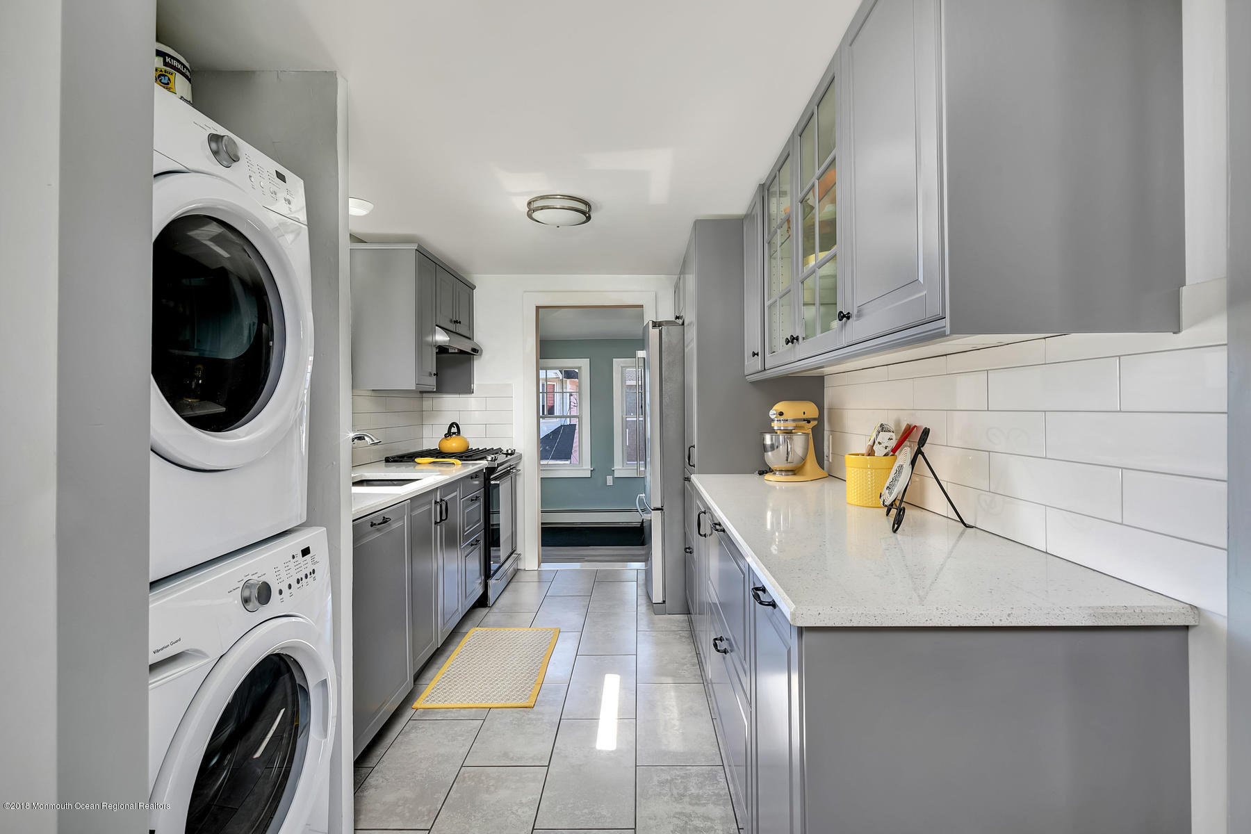 27 Center Street Sea Bright, NJ 07760 - Photo 29 of 51 a kitchen with a sink a washer and dryer