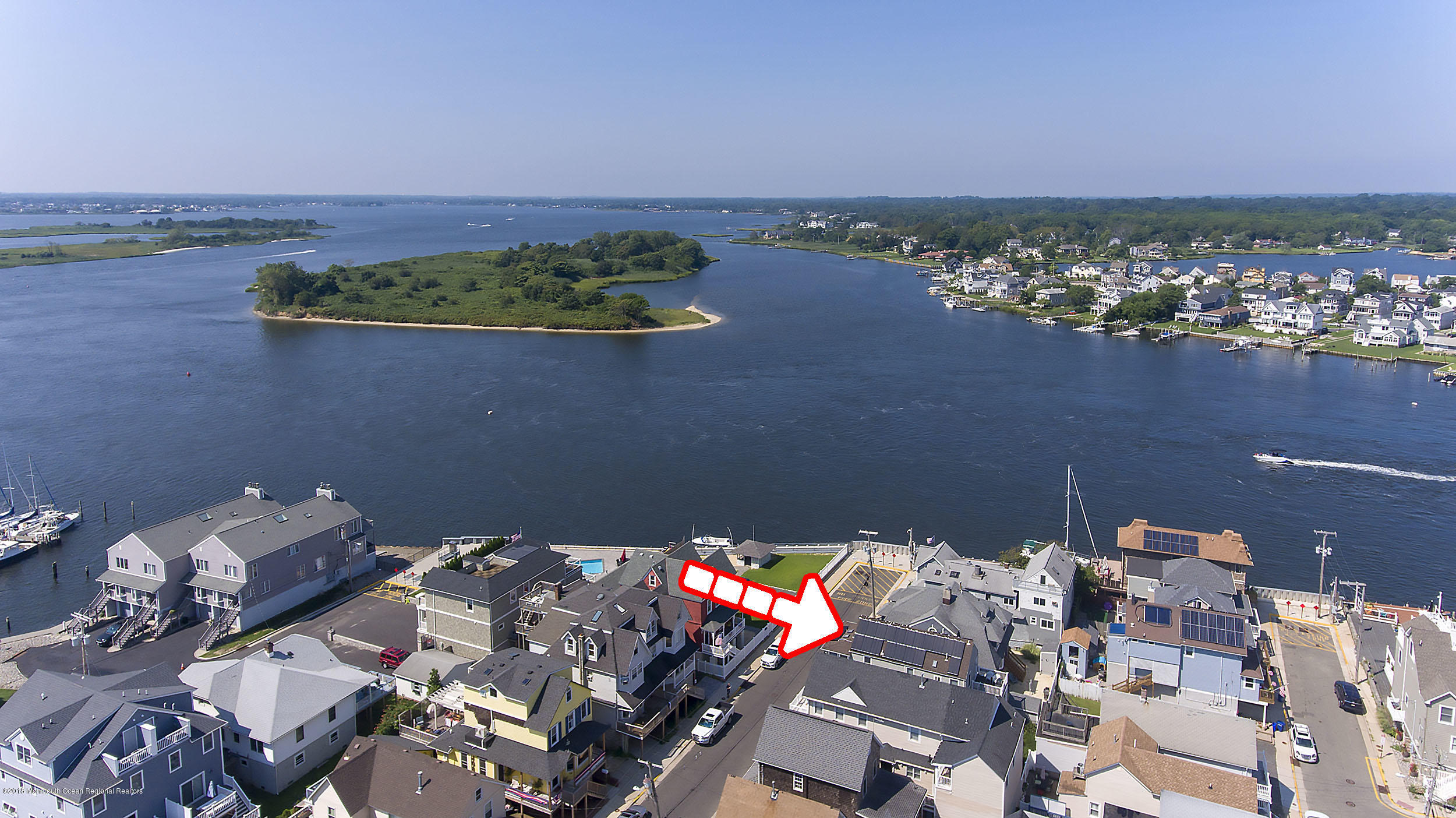 27 Center Street Sea Bright, NJ 07760 - Photo 4 of 51 an aerial view of a house with a lake view