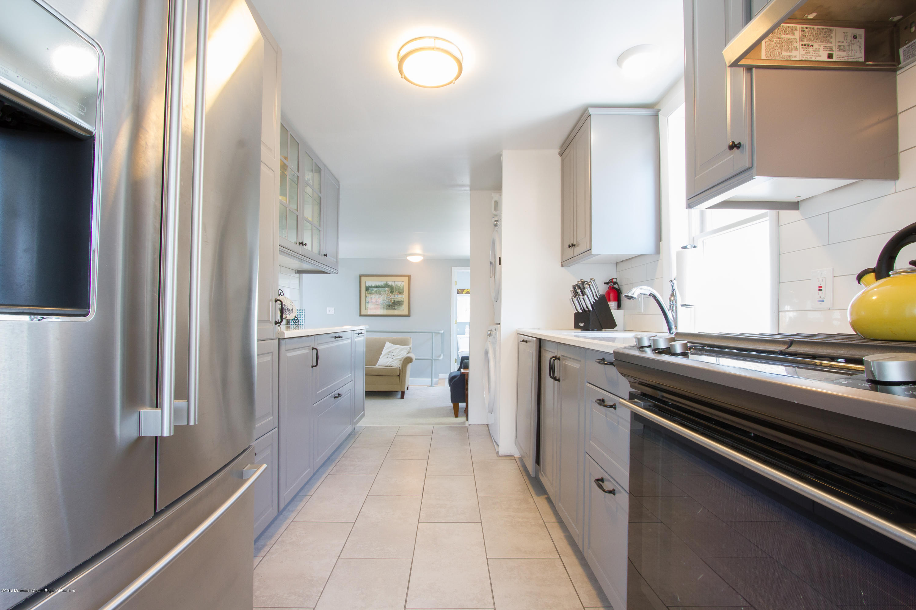 27 Center Street Sea Bright, NJ 07760 - Photo 32 of 51 a kitchen with a sink appliances and cabinets