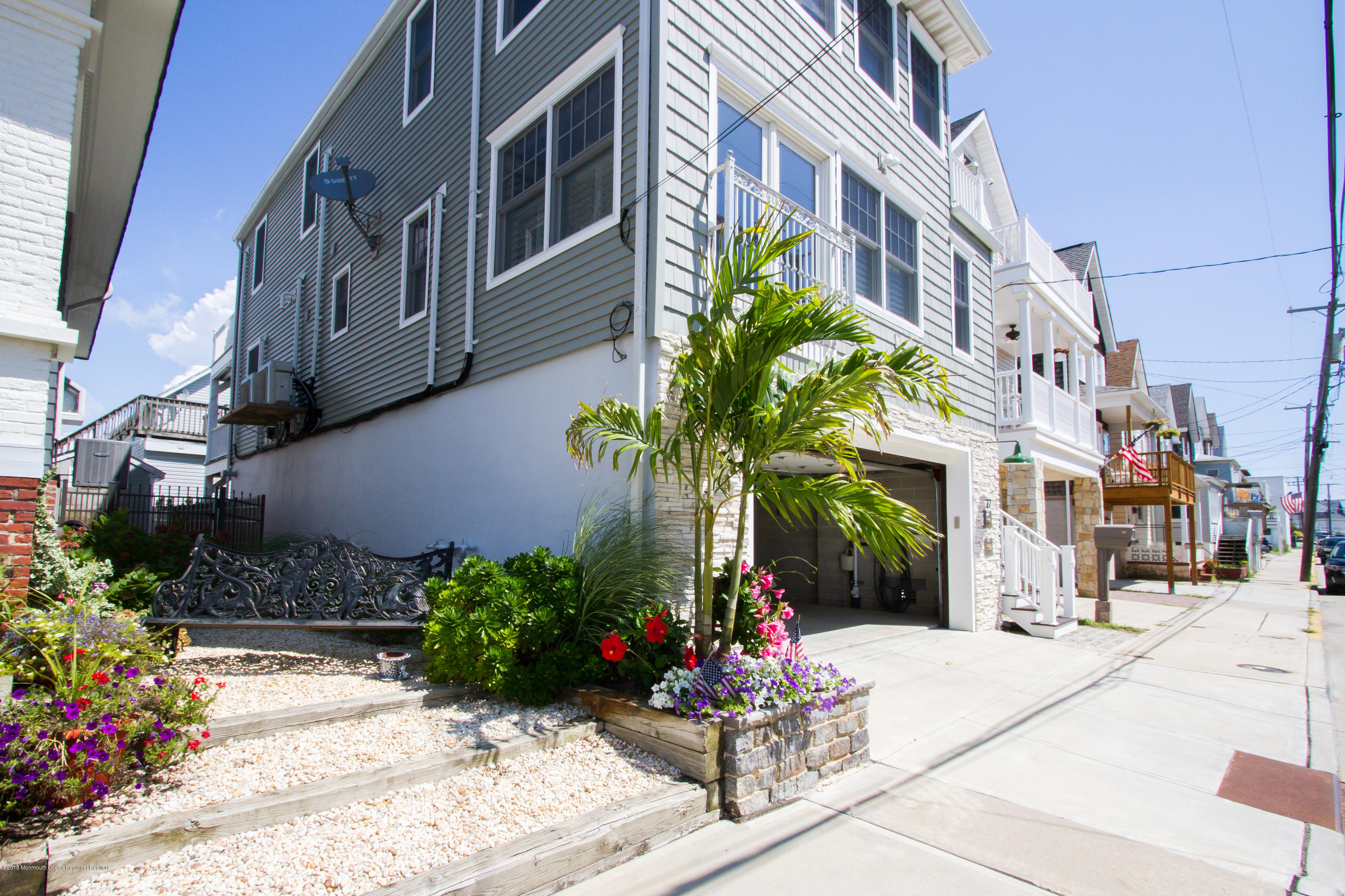 27 Center Street Sea Bright, NJ 07760 - Photo 37 of 51 a building with potted plants in front of it