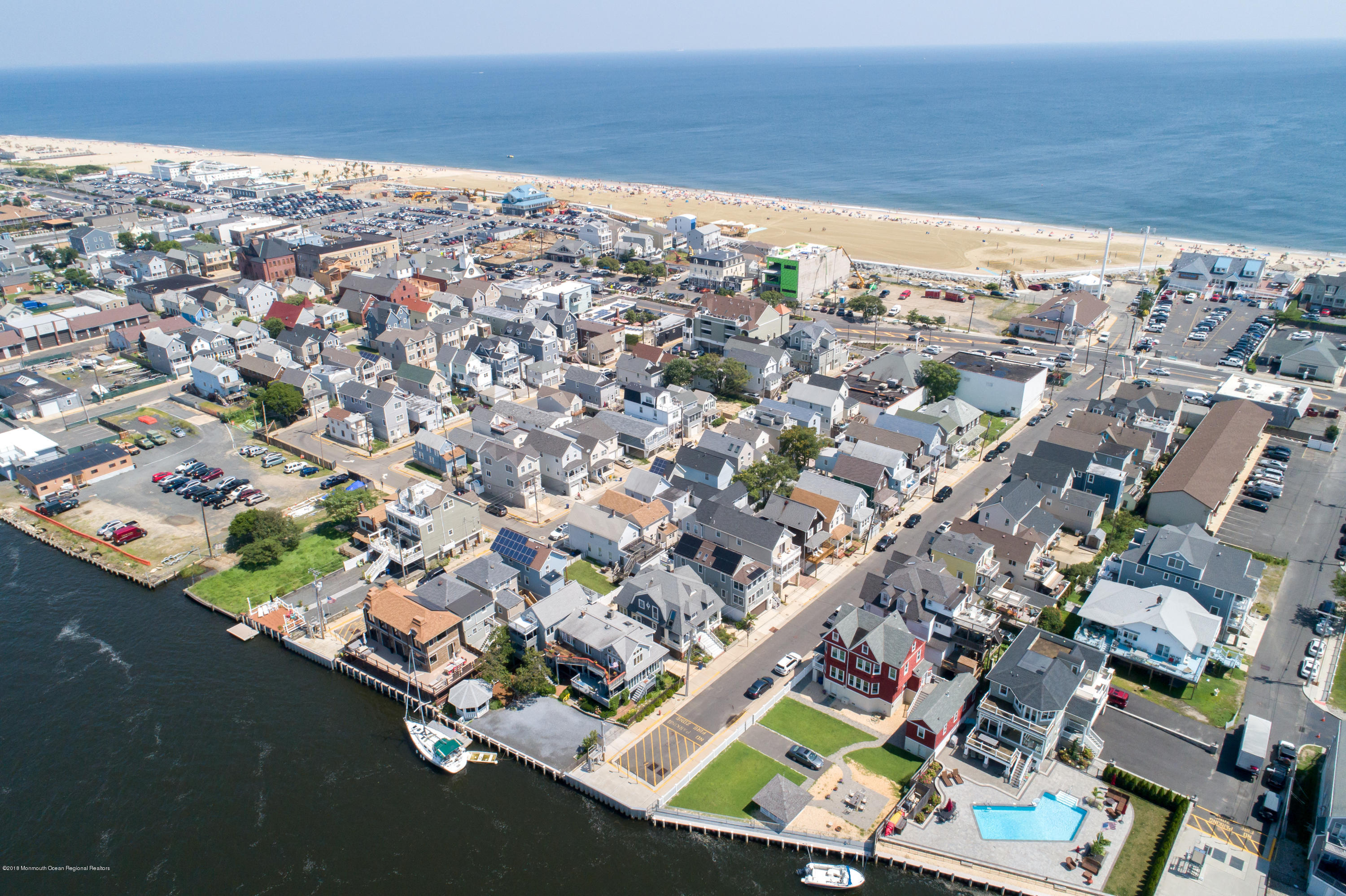 27 Center Street Sea Bright, NJ 07760 - Photo 7 of 51 an aerial view of residential houses with outdoor space and ocean view