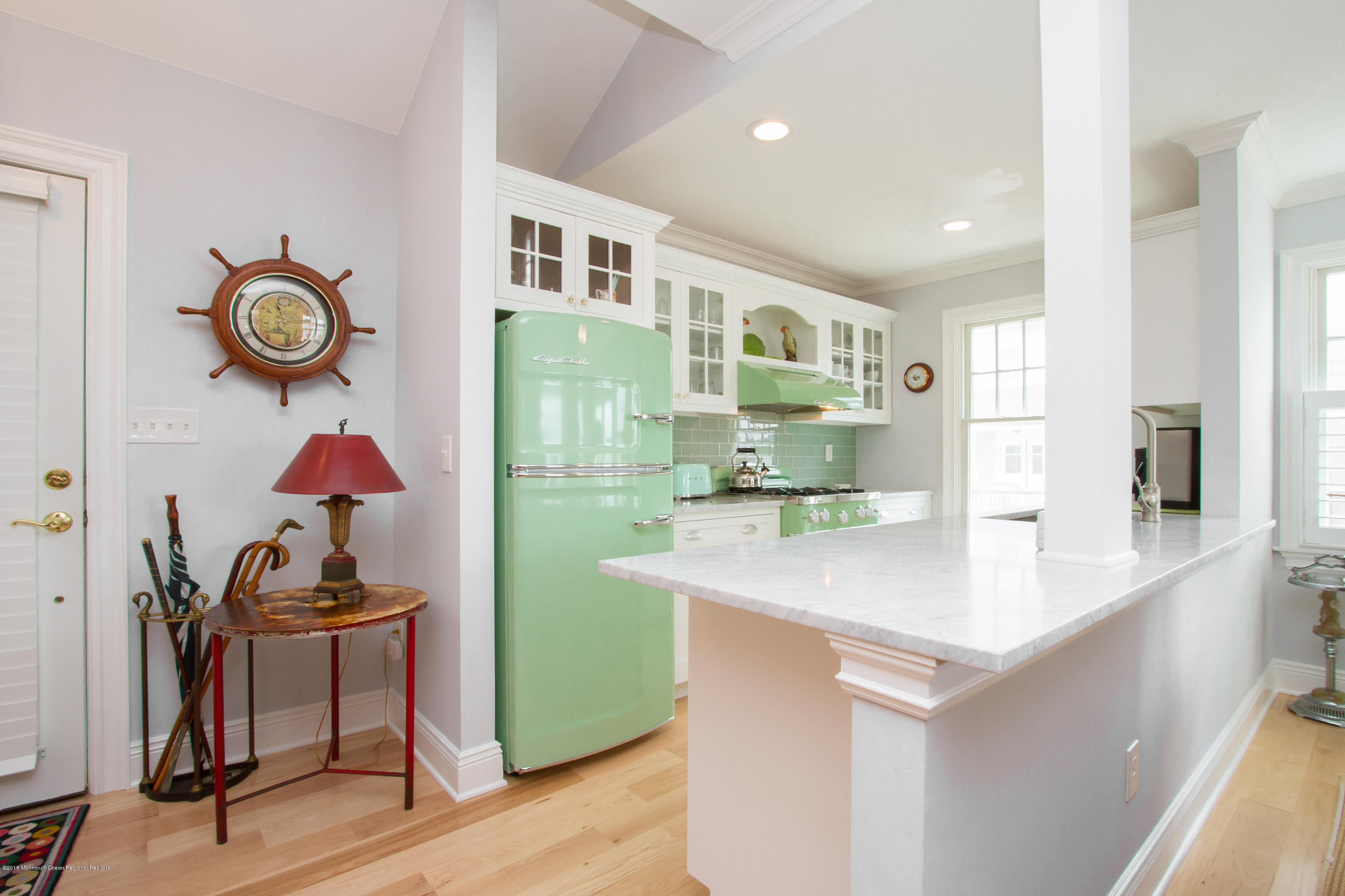 27 Center Street Sea Bright, NJ 07760 - Photo 8 of 51 a view of kitchen island with wooden floor