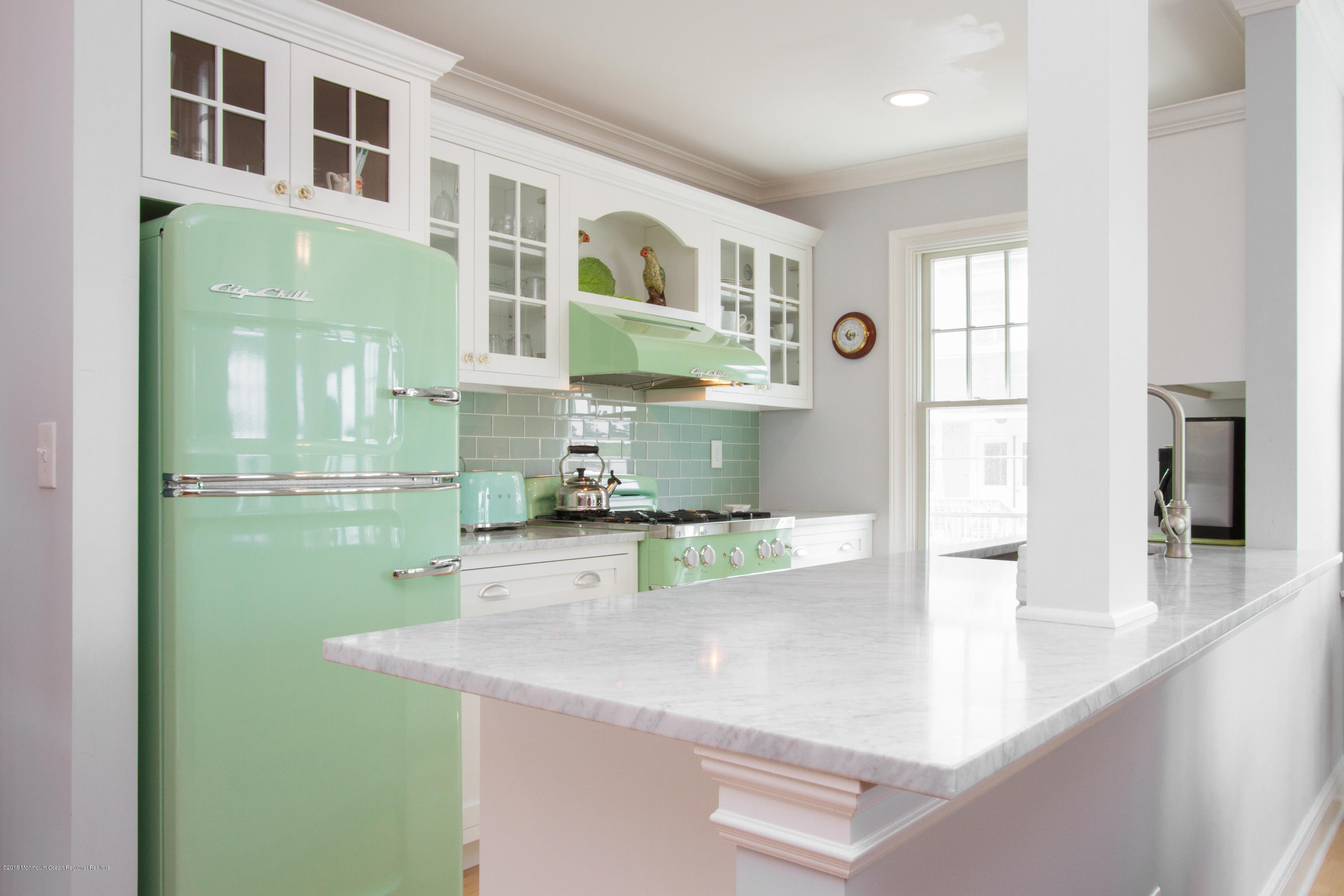 27 Center Street Sea Bright, NJ 07760 - Photo 9 of 51 a kitchen with a sink and a refrigerator