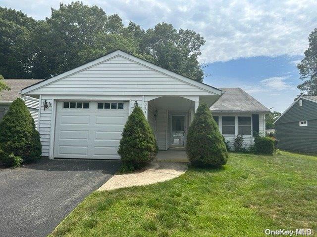 263 Edinburgh Drive, Unit 263 Ridge, NY 11961 - Photo 1 of 1 a view of a house with a yard
