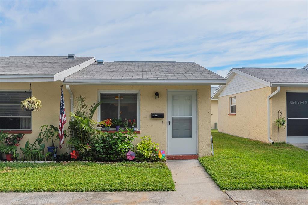4923 Docner Street New Port Richey, FL 34652 - Photo 1 of 1 a front view of a house with a garden