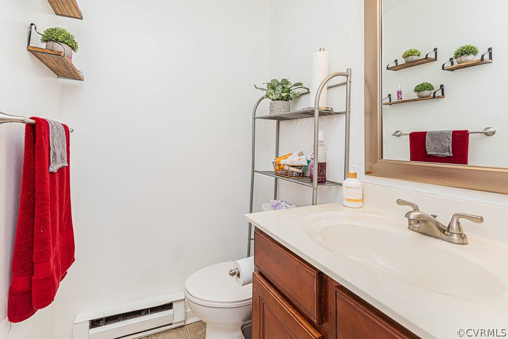2713 South Ridge Drive Midlothian, VA 23112 - Photo 26 of 49 a bathroom with a sink a toilet and vanity