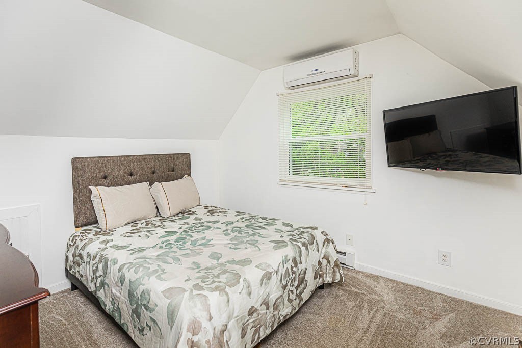 2713 South Ridge Drive Midlothian, VA 23112 - Photo 32 of 49 a bed sitting in a bedroom next to a window