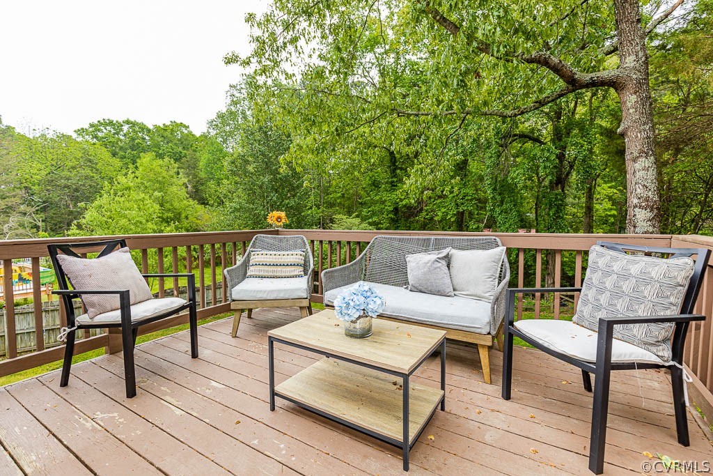 2713 South Ridge Drive Midlothian, VA 23112 - Photo 37 of 49 a balcony with chairs and wooden floor