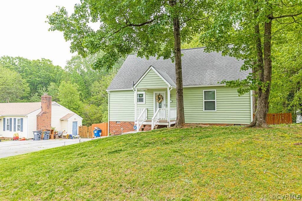 2713 South Ridge Drive Midlothian, VA 23112 - Photo 49 of 49 a front view of a house with a garden and yard