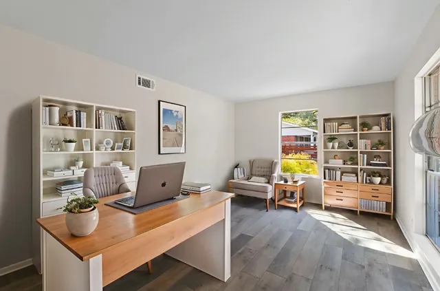 a room with furniture and gym equipment