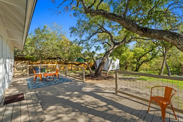 a view of a park with large trees